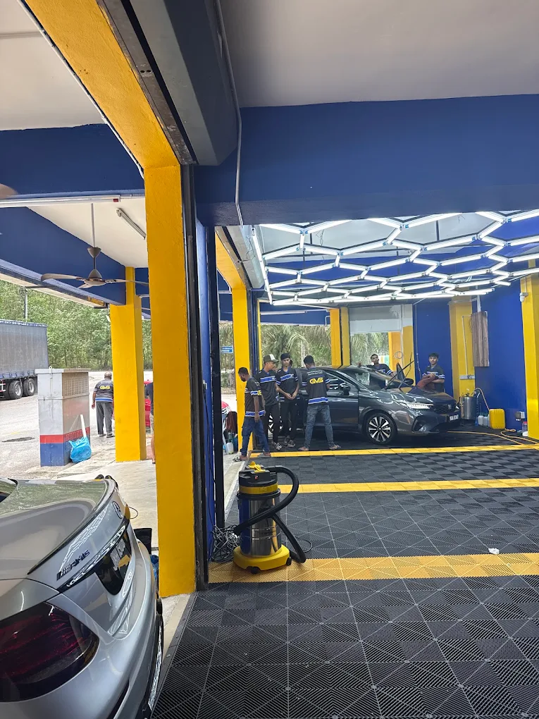 The GVS Autospa crew working on a car inside the wash bay