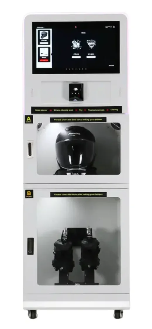 The self-service helmet and shoe cleaning machine, with a helmet in the upper compartment and boots in the lower one
